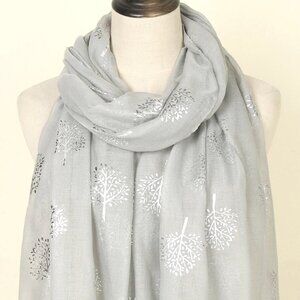 Elegant Luxurious scarf or wrap features a sophisticated 3D leaf pattern